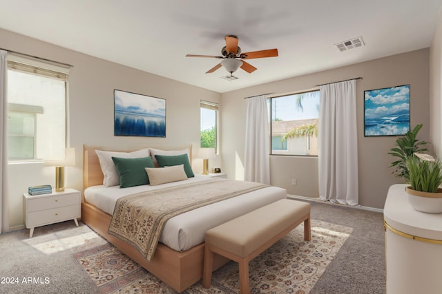 bedroom with carpet flooring, baseboards, visible vents, and ceiling fan