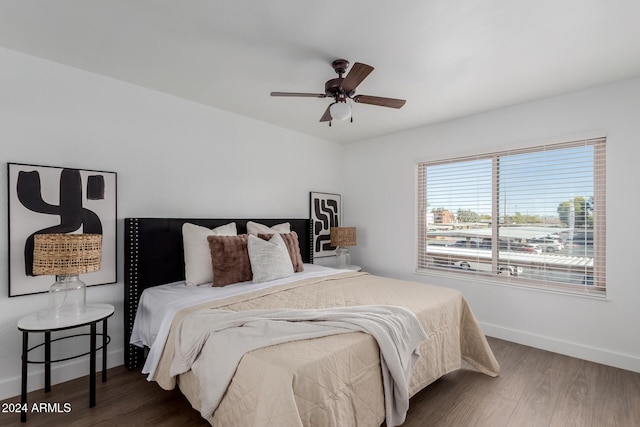 bedroom featuring ceiling fan and dark hardwood / wood-style flooring