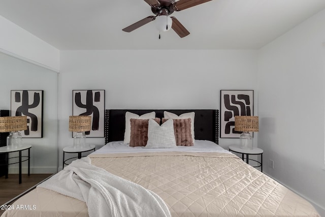 bedroom with ceiling fan and dark wood-type flooring