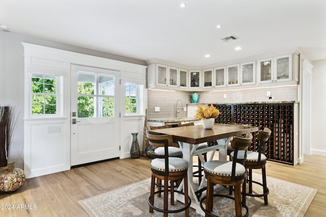 dining space with light wood-type flooring