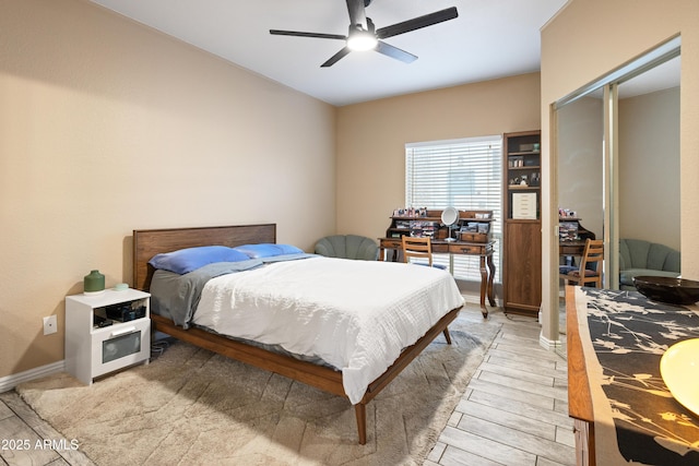 bedroom featuring a ceiling fan and light wood-style floors