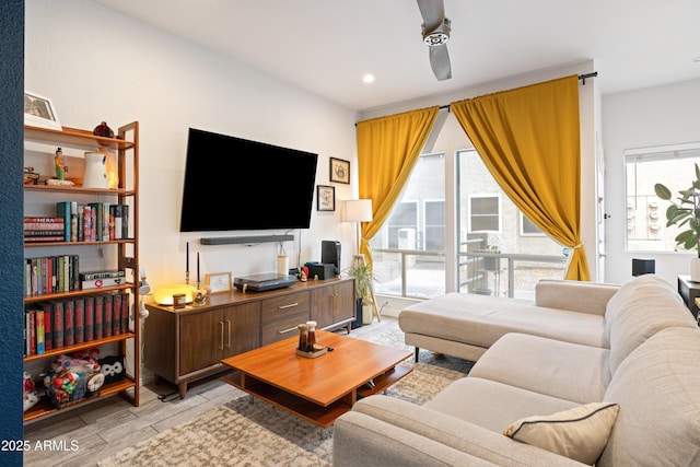 living room featuring wood finish floors and recessed lighting