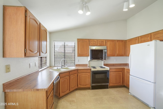 kitchen featuring stainless steel appliances, lofted ceiling, a sink, and light tile patterned floors