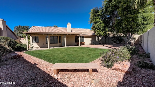 back of property featuring a tile roof, a patio, a fenced backyard, and stucco siding