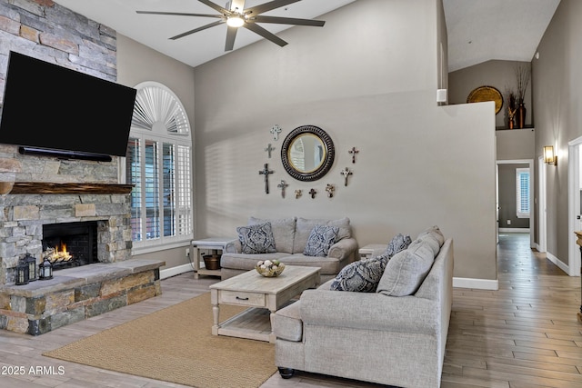 26475 N Wrangler Rd, Scottsdale, AZ 85255 - living area with high vaulted ceiling, ceiling fan, wood finished floors, and a fireplace