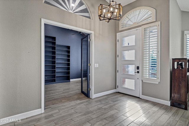 26475 N Wrangler Rd, Scottsdale, AZ 85255 - foyer featuring wood finished floors and a chandelier