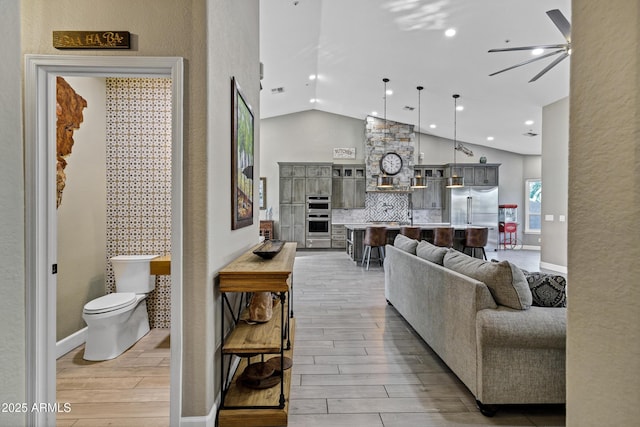 26475 N Wrangler Rd, Scottsdale, AZ 85255 - living room featuring light wood-style flooring, a ceiling fan, high vaulted ceiling, and recessed lighting