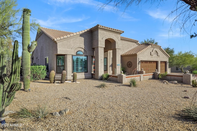 26475 N Wrangler Rd, Scottsdale, AZ 85255 - mediterranean / spanish-style house with stucco siding, a tile roof, and a garage