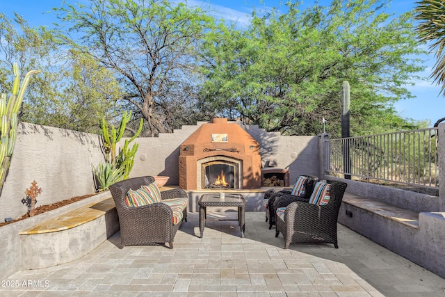 26475 N Wrangler Rd, Scottsdale, AZ 85255 - fenced backyard with a patio area and an outdoor living space with a fireplace