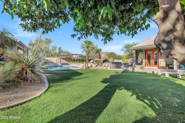 26475 N Wrangler Rd, Scottsdale, AZ 85255 - view of grassy yard with french doors, a pergola, a hot tub, and a patio area