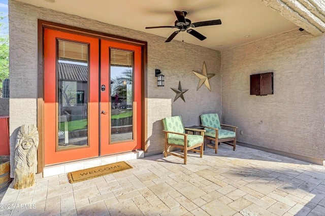 26475 N Wrangler Rd, Scottsdale, AZ 85255 - property entrance featuring french doors, ceiling fan, a patio, and stucco siding
