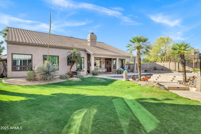 26475 N Wrangler Rd, Scottsdale, AZ 85255 - back of property featuring a tile roof, a patio area, a chimney, and stucco siding