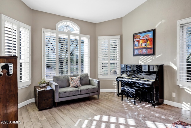 26475 N Wrangler Rd, Scottsdale, AZ 85255 - living area featuring wood finished floors and healthy amount of natural light