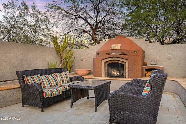 26475 N Wrangler Rd, Scottsdale, AZ 85255 - fenced backyard with an outdoor living space with a fireplace and a patio area