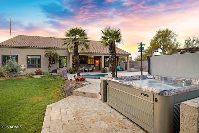 26475 N Wrangler Rd, Scottsdale, AZ 85255 - patio terrace at dusk featuring a patio area and a hot tub