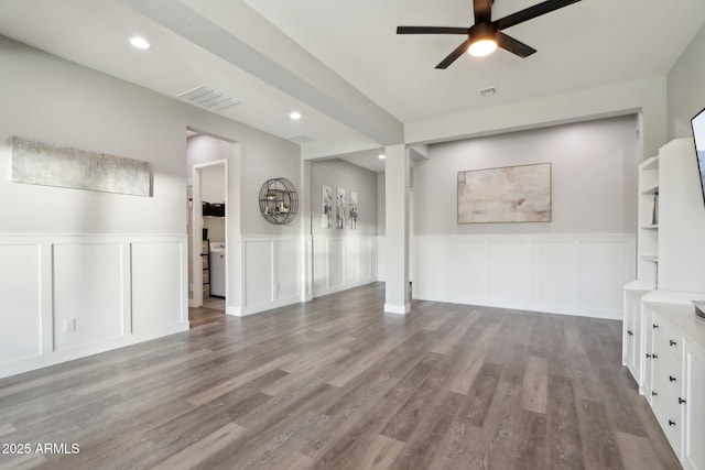 unfurnished living room with ceiling fan and hardwood / wood-style floors