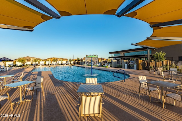 view of swimming pool featuring pool water feature