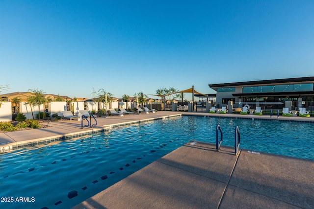 view of swimming pool with a patio