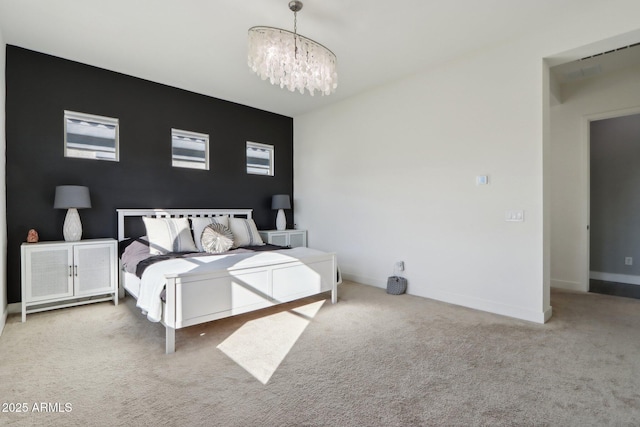 carpeted bedroom with a chandelier