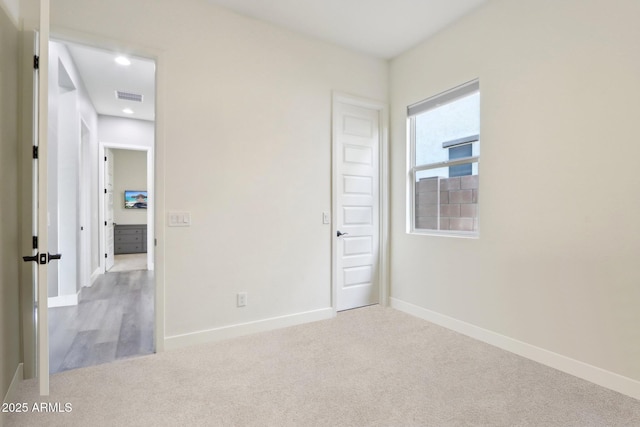 view of carpeted spare room