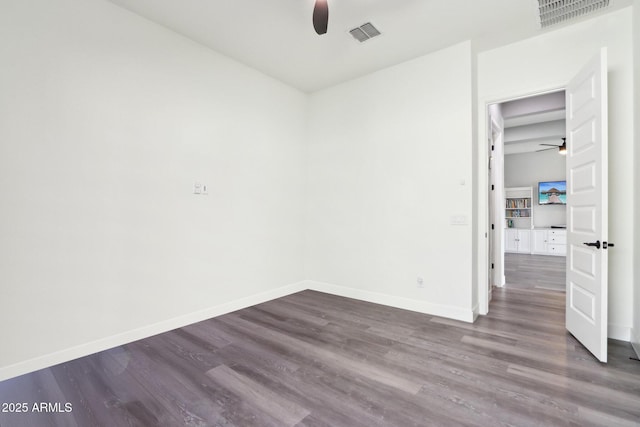 spare room featuring ceiling fan and wood-type flooring