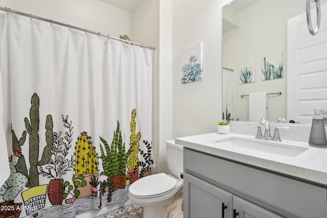 bathroom with vanity, toilet, and a shower with shower curtain