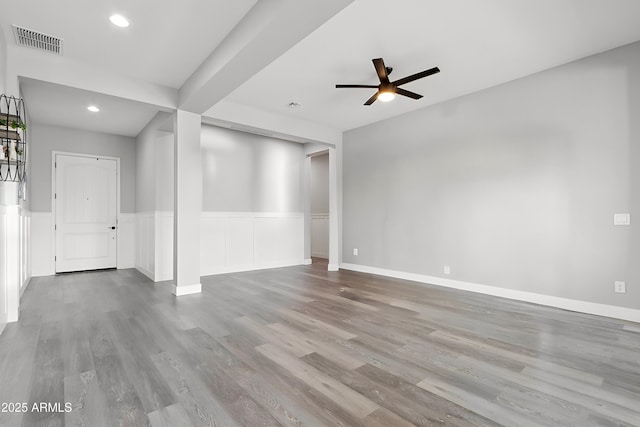 unfurnished living room featuring ceiling fan and light wood-type flooring