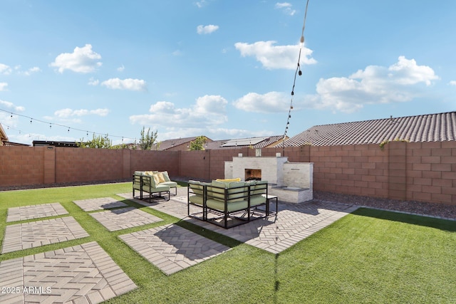 view of yard featuring an outdoor living space with a fireplace and a patio