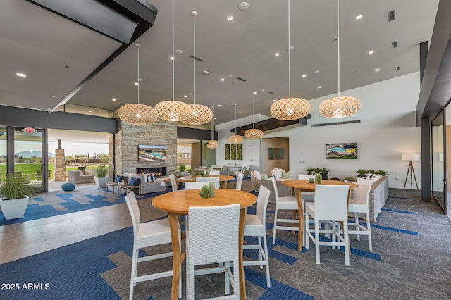 dining area with a stone fireplace