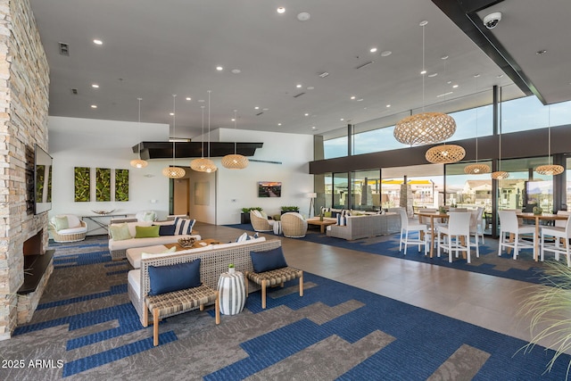 living room featuring a high ceiling