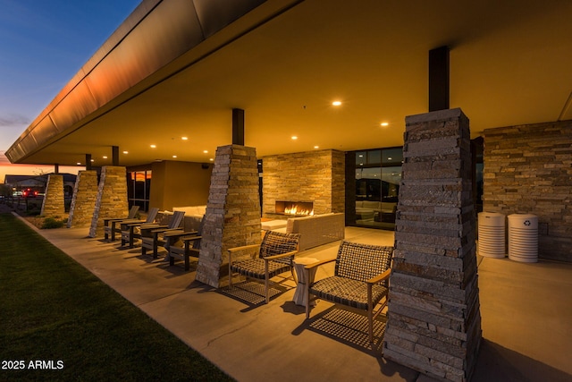 view of patio terrace at dusk