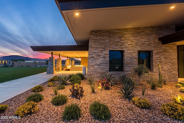 view of patio terrace at dusk