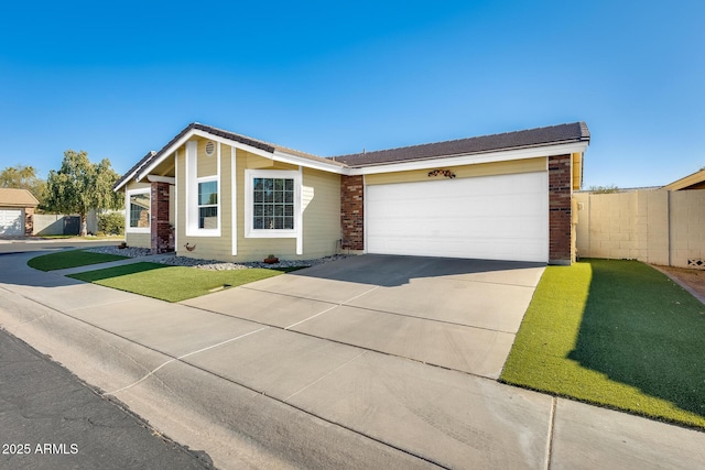 ranch-style home with a garage and a front yard