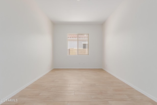 unfurnished room with light hardwood / wood-style floors