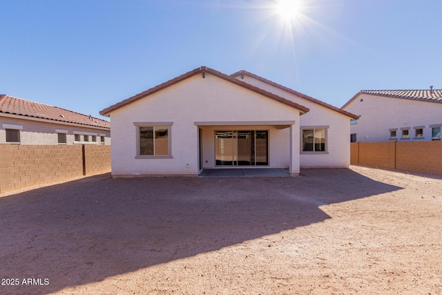 back of property with a patio area