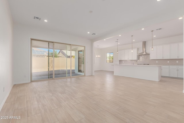 unfurnished living room with sink