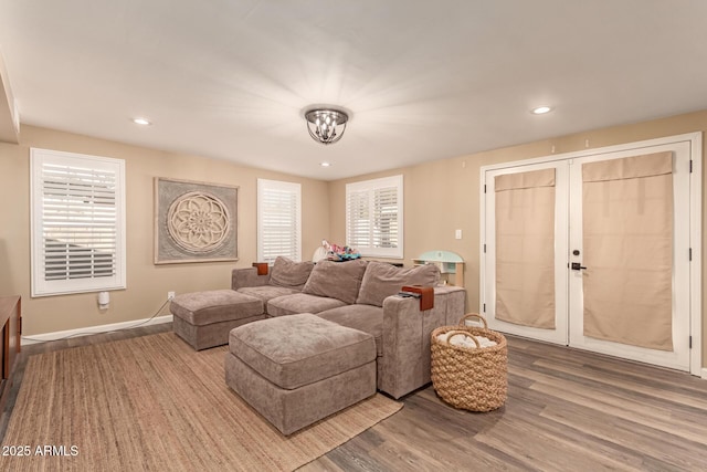 living room with hardwood / wood-style floors and french doors