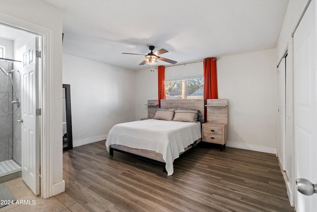 bedroom with ensuite bath, ceiling fan, and dark wood-type flooring