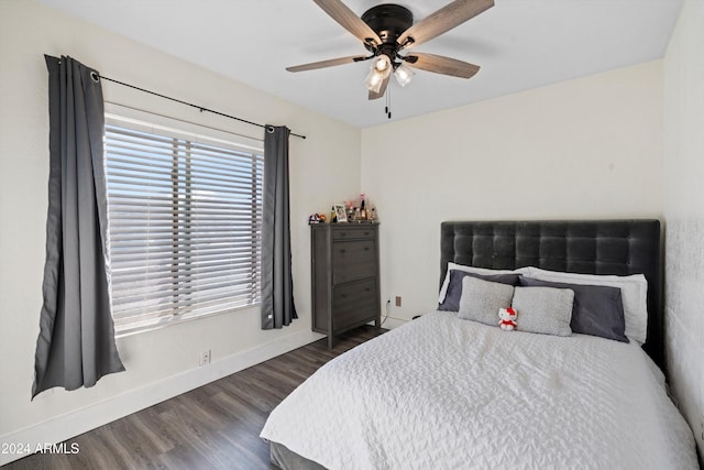 bedroom with ceiling fan and dark wood-type flooring