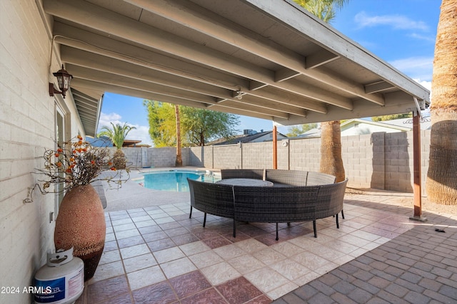 view of patio featuring a fenced in pool