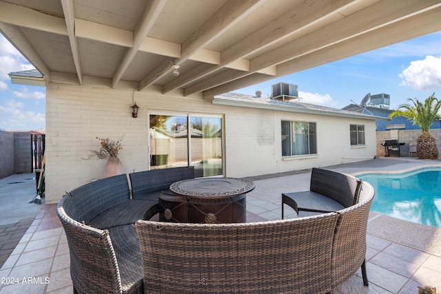 view of patio with a fenced in pool