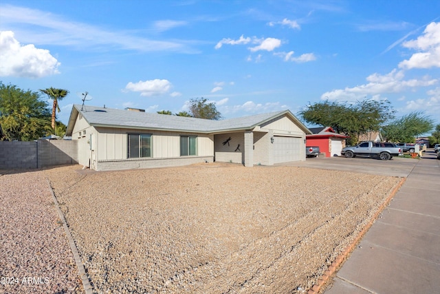 single story home featuring a garage