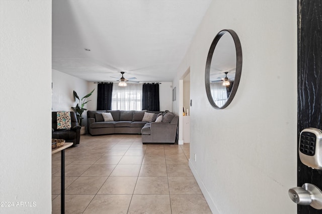 living room with ceiling fan and light tile patterned floors