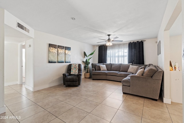 living room featuring ceiling fan and light tile patterned flooring