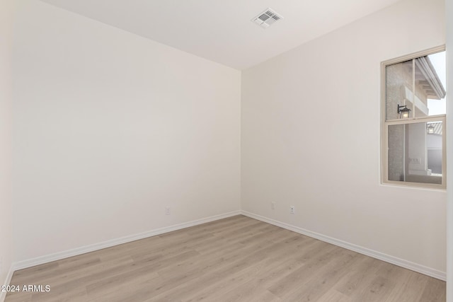 spare room with light hardwood / wood-style floors