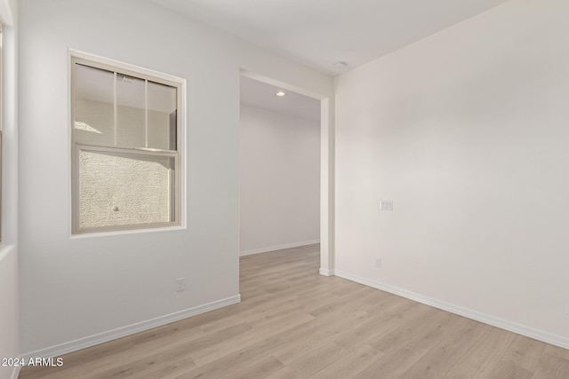 unfurnished room with light hardwood / wood-style flooring