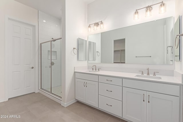 bathroom with vanity and an enclosed shower