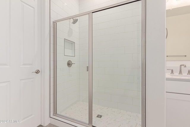 bathroom with vanity and an enclosed shower