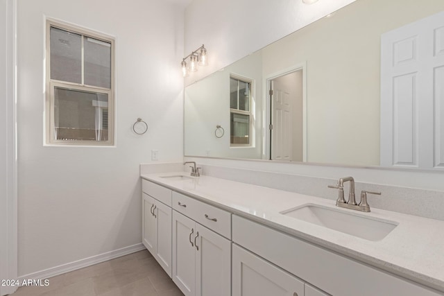 bathroom featuring tile patterned flooring and vanity