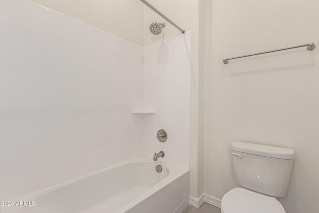 bathroom featuring shower / bath combination and toilet